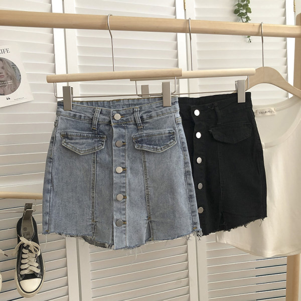 Naiste nööpide ja rebenenud motiividega teksaseelik