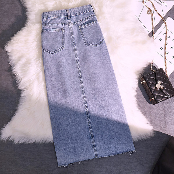 Pikk teksaseelik taskute ja embleemiga