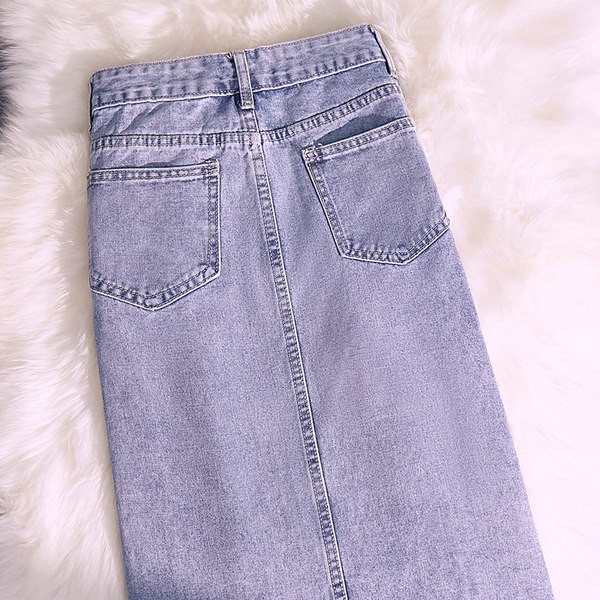 Pikk teksaseelik taskute ja embleemiga