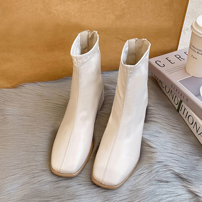 Дамски кожени боти с цип в черен и бял цвят