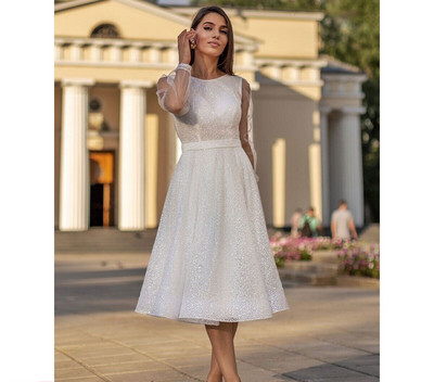 Women`s dress with tulle sleeves in white