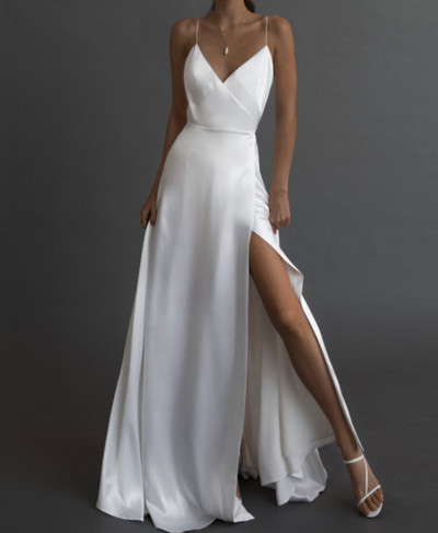 Long women`s dress with a slit and thin straps
