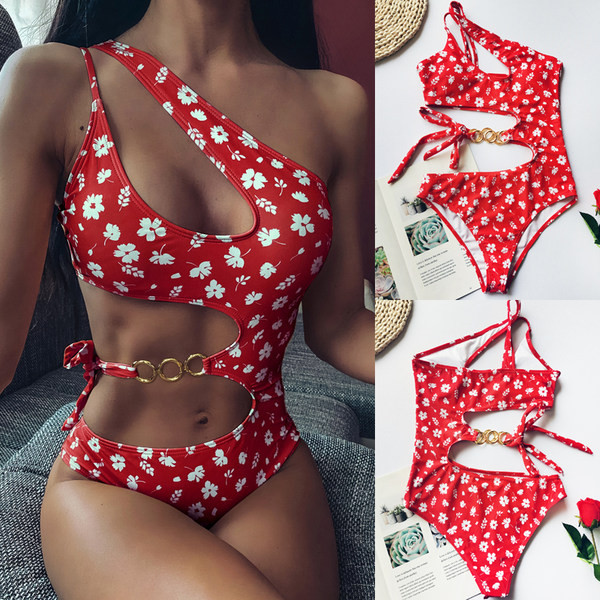 Női teljes fürdőruha kivágásokkal, fém díszítéssel