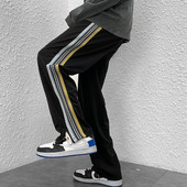 Naistele pikad spordipüksid küljeäärega