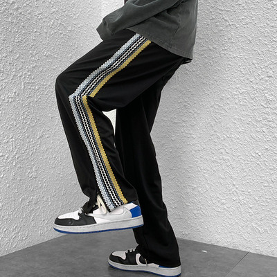 Naistele pikad spordipüksid küljeäärega