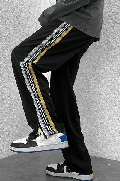 Naistele pikad spordipüksid küljeäärega