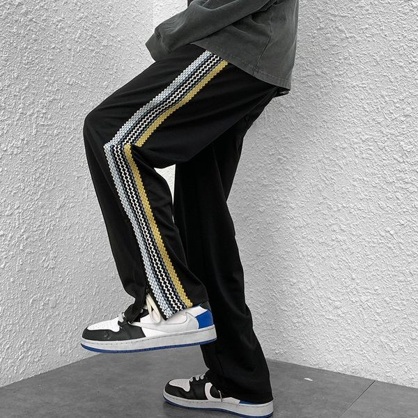 Naistele pikad spordipüksid küljeäärega