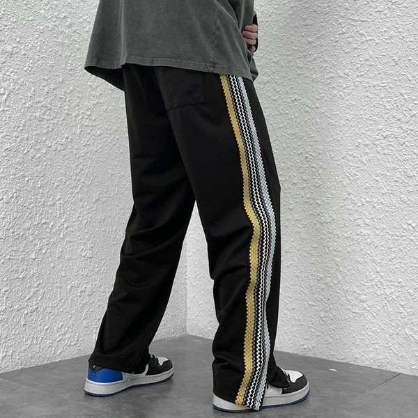 Naistele pikad spordipüksid küljeäärega