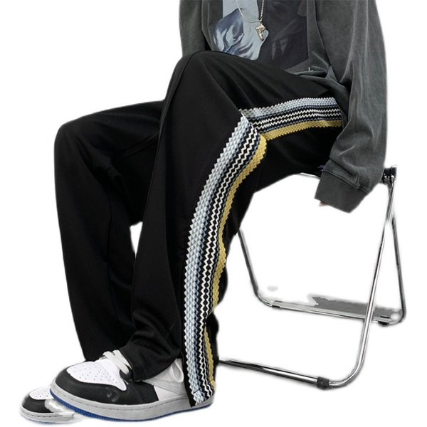 Naistele pikad spordipüksid küljeäärega