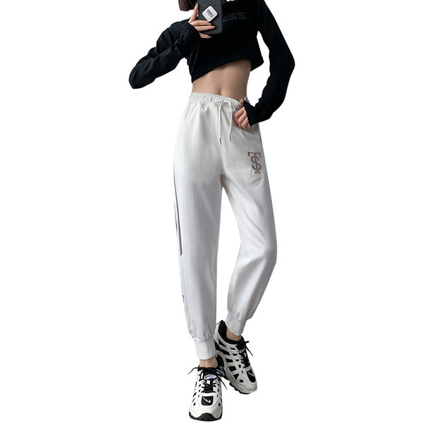 Naiste kevadised tikandiga spordipüksid