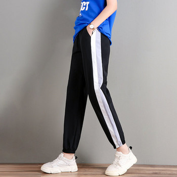 Дамски спортен панталон с кант и джобове