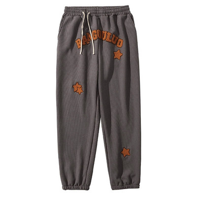 Спортно долнище с бродиран надпис 