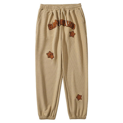 Спортно долнище с бродиран надпис 