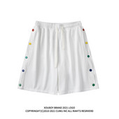 Naiste lipsude ja värviliste nööpidega lühikesed püksid