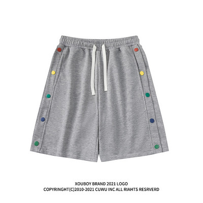 Naiste lipsude ja värviliste nööpidega lühikesed püksid