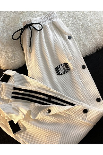 Дамски спортен панталон с копчета и връзки 