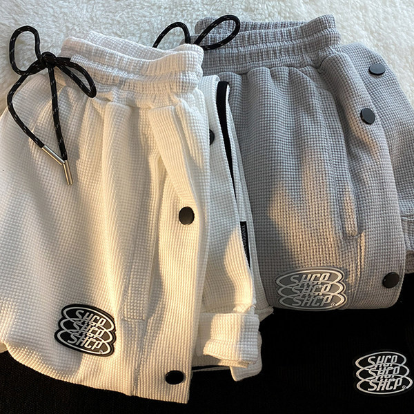 Дамски спортен панталон с копчета и връзки 