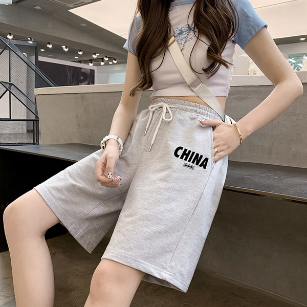 Naiste spordipüksid sirge pealiskirja ja lipsudega mudel