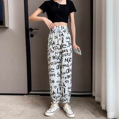 Naiste kirjade ja kõrge vöökohaga püksid