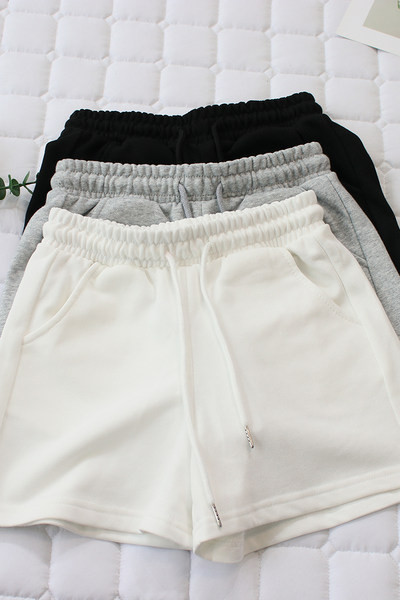 Naiste spordipüksid lipsude ja taskutega