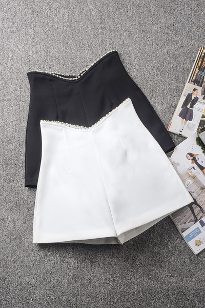 Kõrge vöökohaga ja pärlitega naiste lühikesed püksid