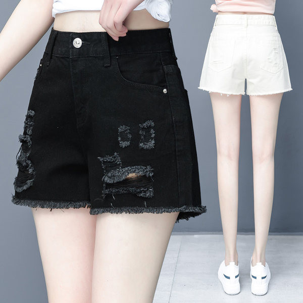 Lühikesed rebenenud motiividega teksad naistele