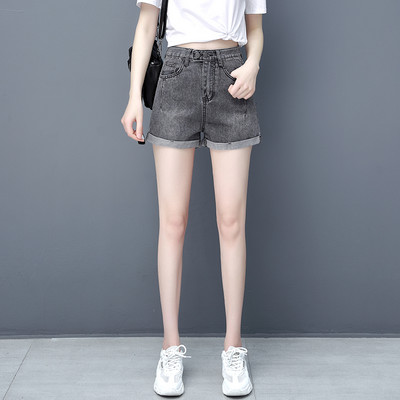 Γυναικείο κοντό τζιν με ασύμμετρο κούμπωμα