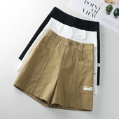 Taskute ja embleemiga vabaajapüksid