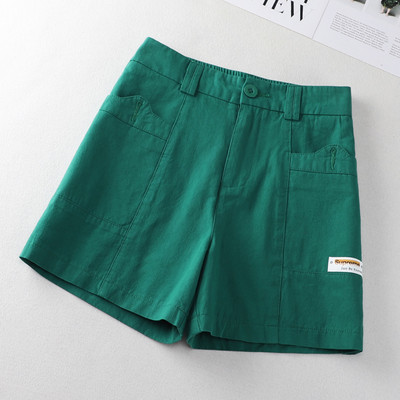 Taskute ja embleemiga vabaajapüksid