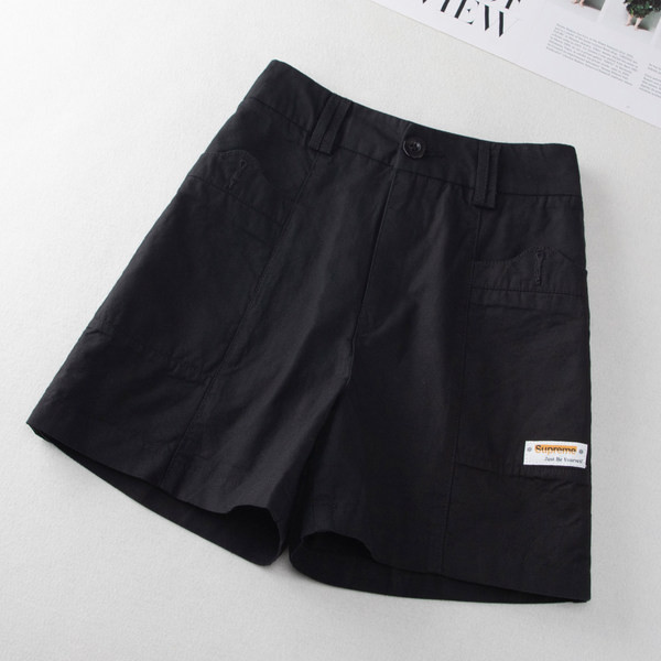 Taskute ja embleemiga vabaajapüksid