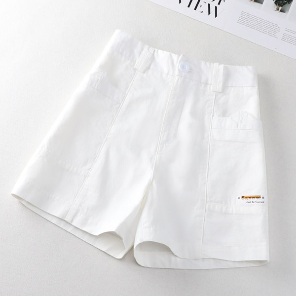 Taskute ja embleemiga vabaajapüksid