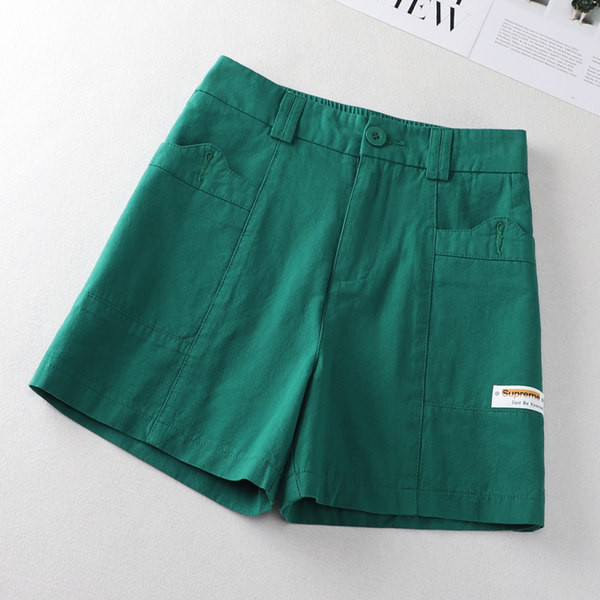 Taskute ja embleemiga vabaajapüksid