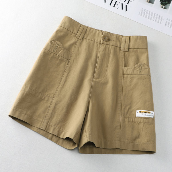 Taskute ja embleemiga vabaajapüksid