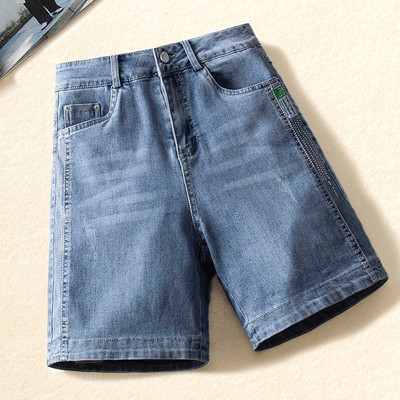 Naiste kõrge vöökoha ja taskutega teksapüksid