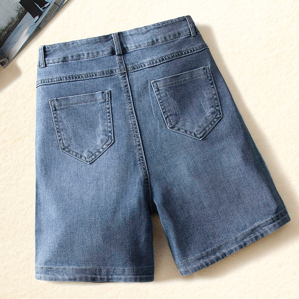 Naiste kõrge vöökoha ja taskutega teksapüksid