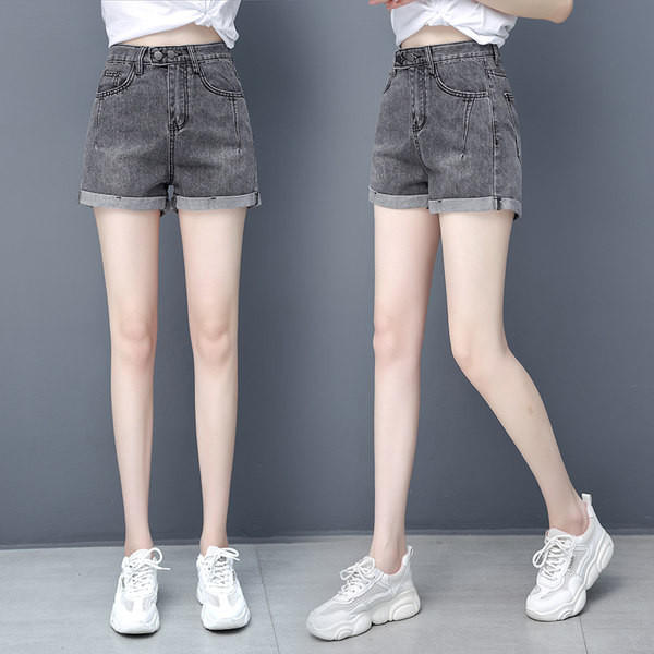 Naistele kõrge vöökoha ja nööpidega teksapüksid