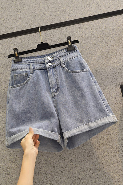 Kõrge vöökohaga nööpidega teksapüksid