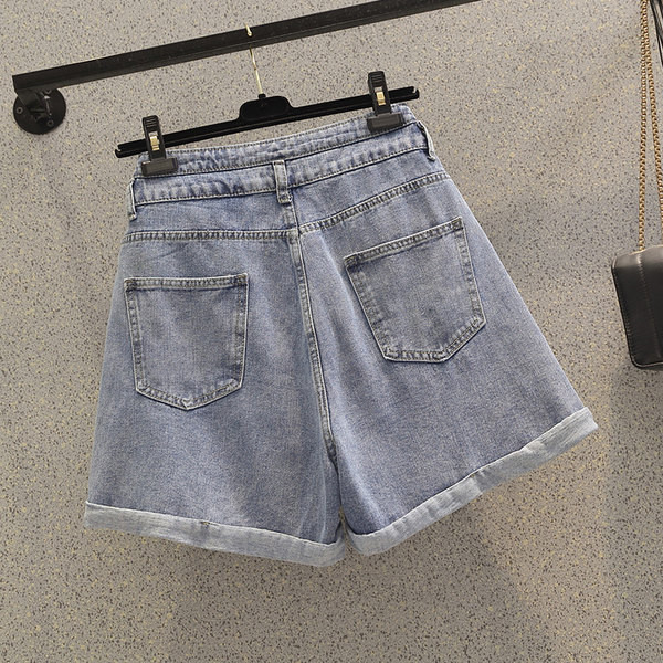 Kõrge vöökohaga nööpidega teksapüksid