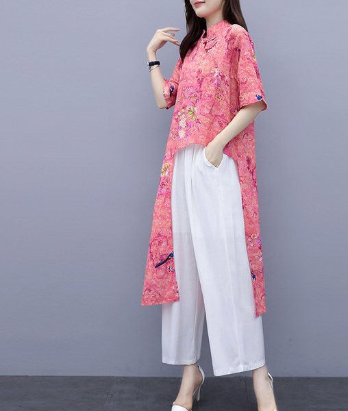 Uue mudeli naiste komplekt kahest osast - asümmeetriline pluus ja püksid