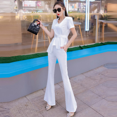 Elegantan ženski komplet - asimetrična bluza s metalnim ukrasom i duge hlače