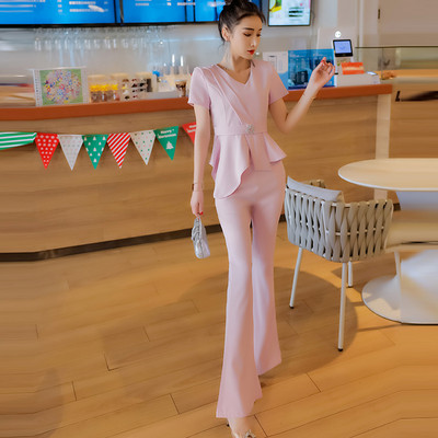 Elegantan ženski komplet - asimetrična bluza s metalnim ukrasom i duge hlače