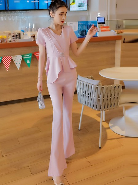 Elegantan ženski komplet - asimetrična bluza s metalnim ukrasom i duge hlače