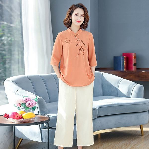 Naiste vabaaja komplekt - tikandiga pluus ja laiad püksid