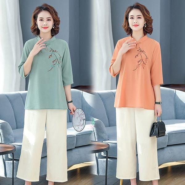 Naiste vabaaja komplekt - tikandiga pluus ja laiad püksid