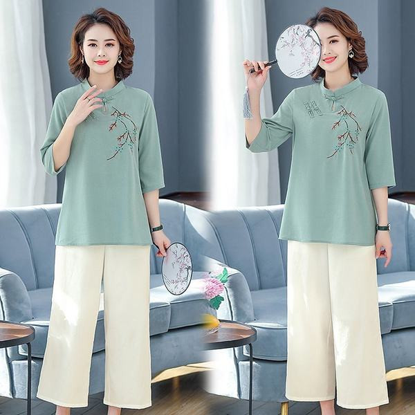 Naiste vabaaja komplekt - tikandiga pluus ja laiad püksid