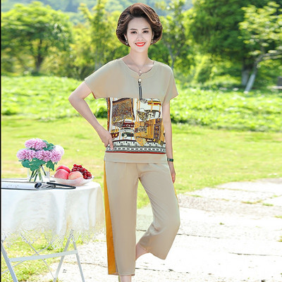 Naiste lukuga pluusi ja pükstega komplekt