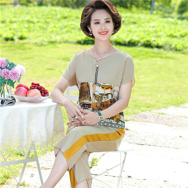 Naiste lukuga pluusi ja pükstega komplekt