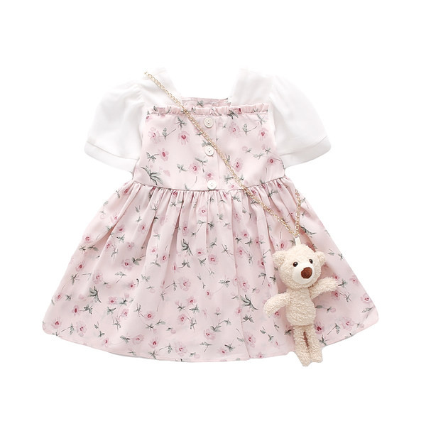 Modern gyerekruha gombokkal és virágmotívumokkal