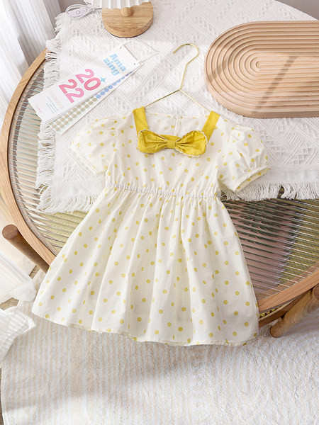 Модерна детска рокля на точки с панделка