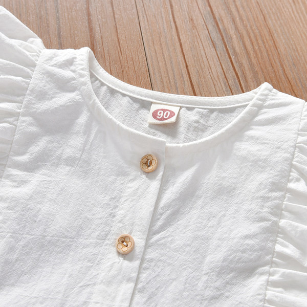 Dječja haljina s ovalnim izrezom i gumbima